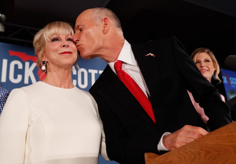Republican Senate candidate Rick Scott kisses his wife Ann as he speaks to supporters at an election watch party, Wednesday, Nov. 7, 2018, in Naples, Fla. (AP Photo/Wilfredo Lee)