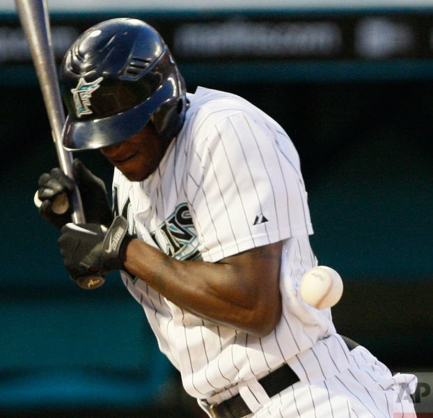 Florida Marlins' Cameron Maybin is hit by a pitch during the second inning of a baseball game against the Atlanta Braves, Wednesday, May 26, 2010 in Miami. (AP Photo/Wilfredo Lee)