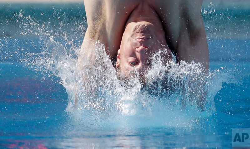 Dwight Dumais dive during a preliminary round of the men's 3-meter springboard event at the USA Diving Grand Prix, Friday, May 10, 2013 in Fort Lauderdale, Fla. (AP Photo/Wilfredo Lee)