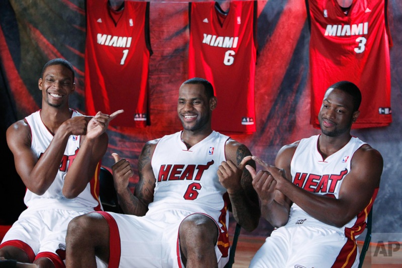 Miami Heat players, from left, Chris Bosh, LeBron James, and Dwyane Wade joke around during Media Day activities, Monday, Sept. 27, 2010 in Coral Gables, Fla. (AP Photo/Wilfredo Lee)